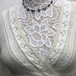 Cozy & sexy this off white sweater by Moda is semi-sheer and is a generous small